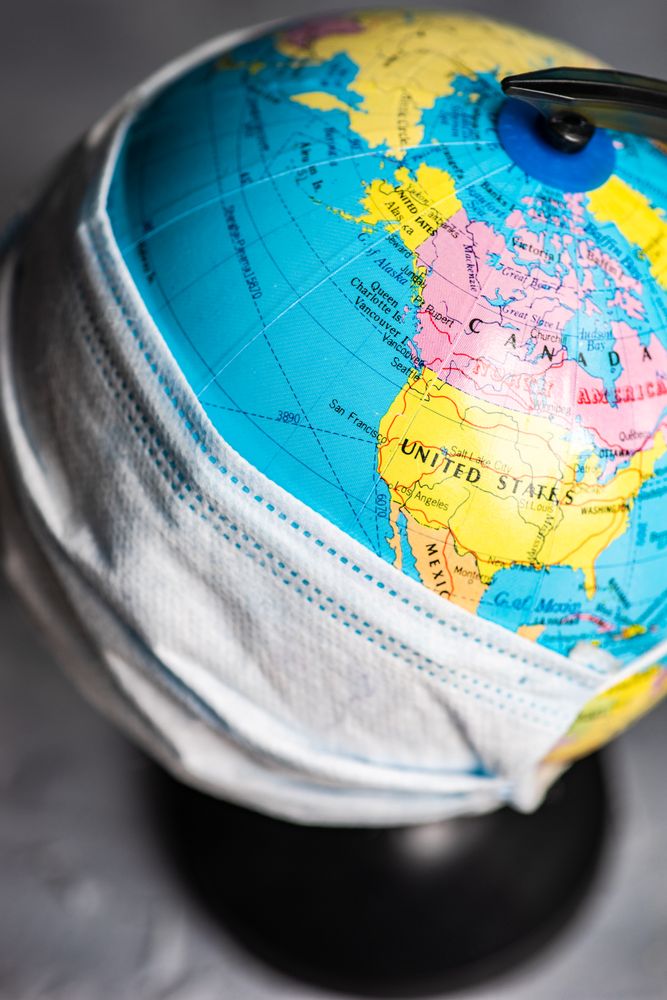 Round globe covered in facemask
