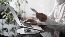 Businessman Working on Laptop at Office Desk