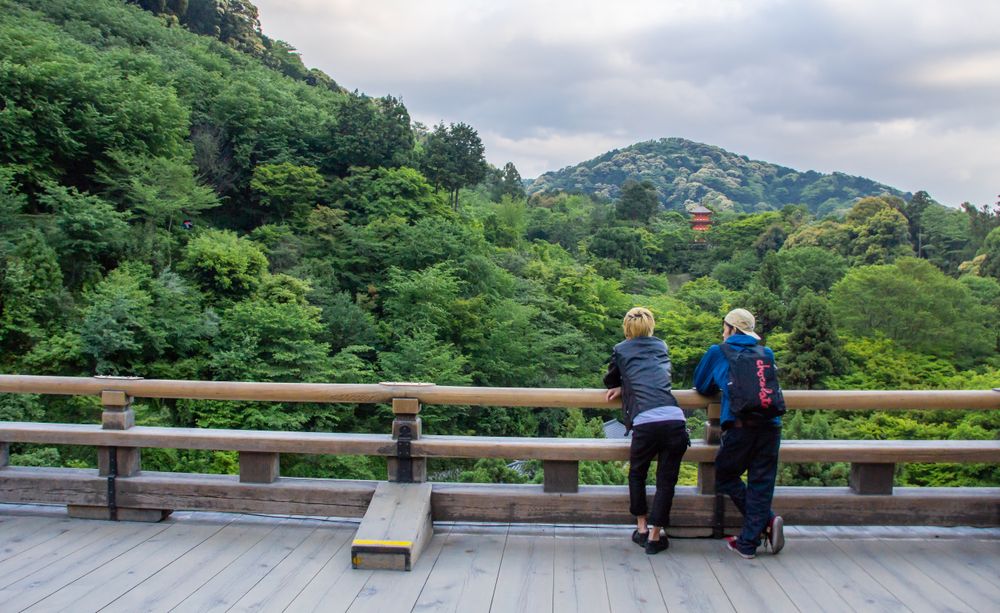 Japan - May, 10 2013: Anonymous persons looking at river and town