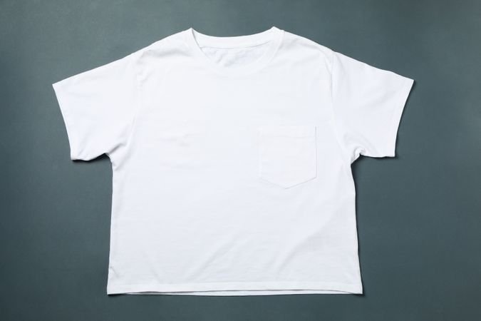 Blank t-shirt on light dark background, space for text