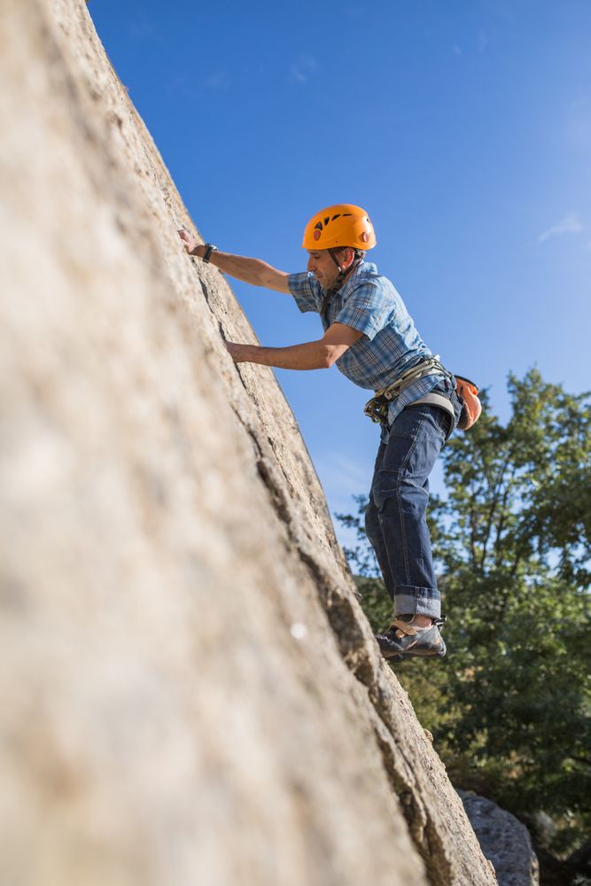 Free climber climbing in nature