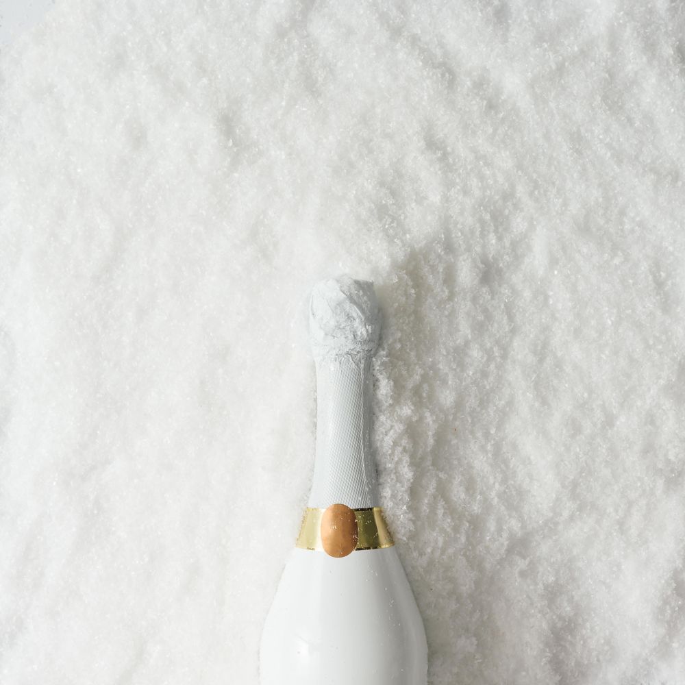 Champagne bottle in snow