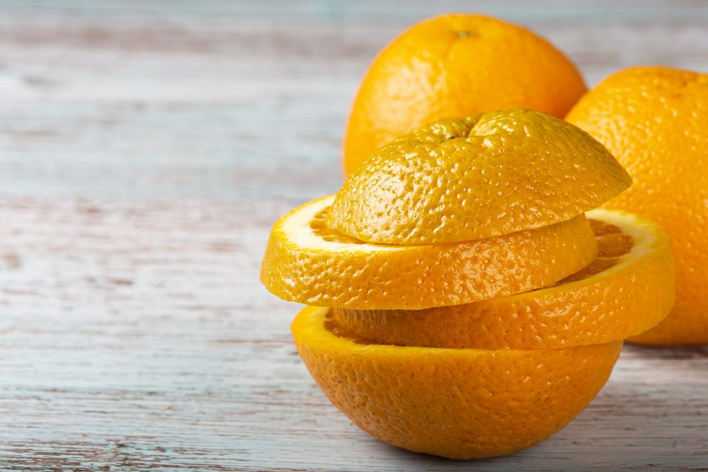 Sliced oranges on the table.