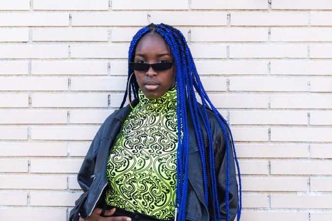 Determined Black woman in trendy clothes in city
