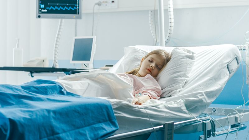 Cute Little Sick Girl Sleeps on a Bed in the Children's Hospital