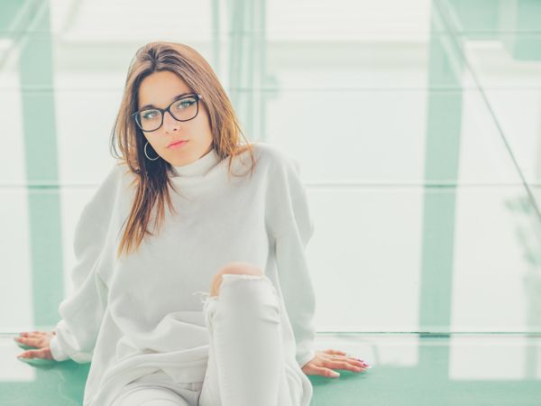 Young woman over a glasses ground