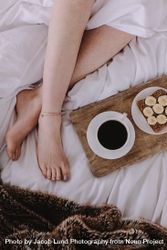 Top view of a woman in bed with breakfast 4jVjgW