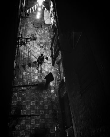 Top view of people walking in alley in Al Khankah, Cairo Governorate, Egypt
