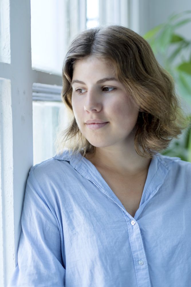 Serene woman's face closeup with dreamy expression