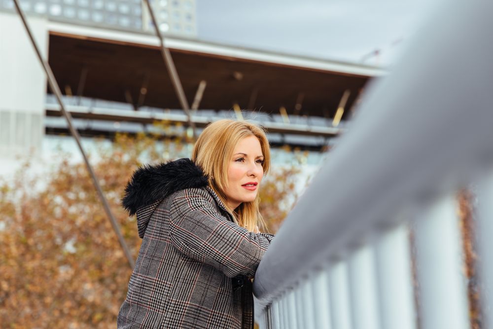 Blonde woman posing in the city
