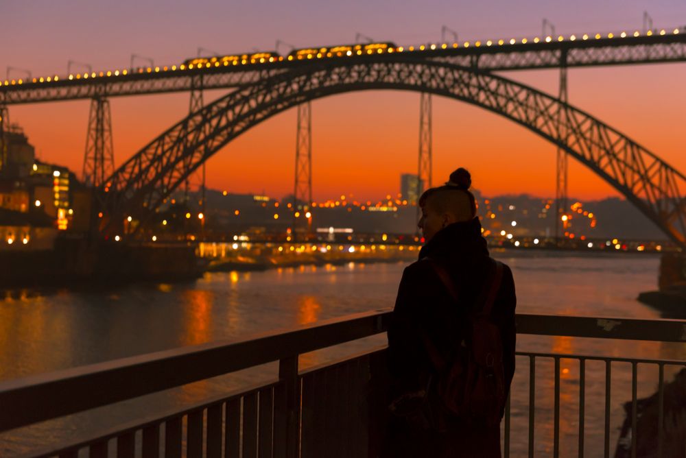 Female walking on embankment during sundown