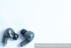 Top view of wireless earbuds on plain table with copy space 5kREBG