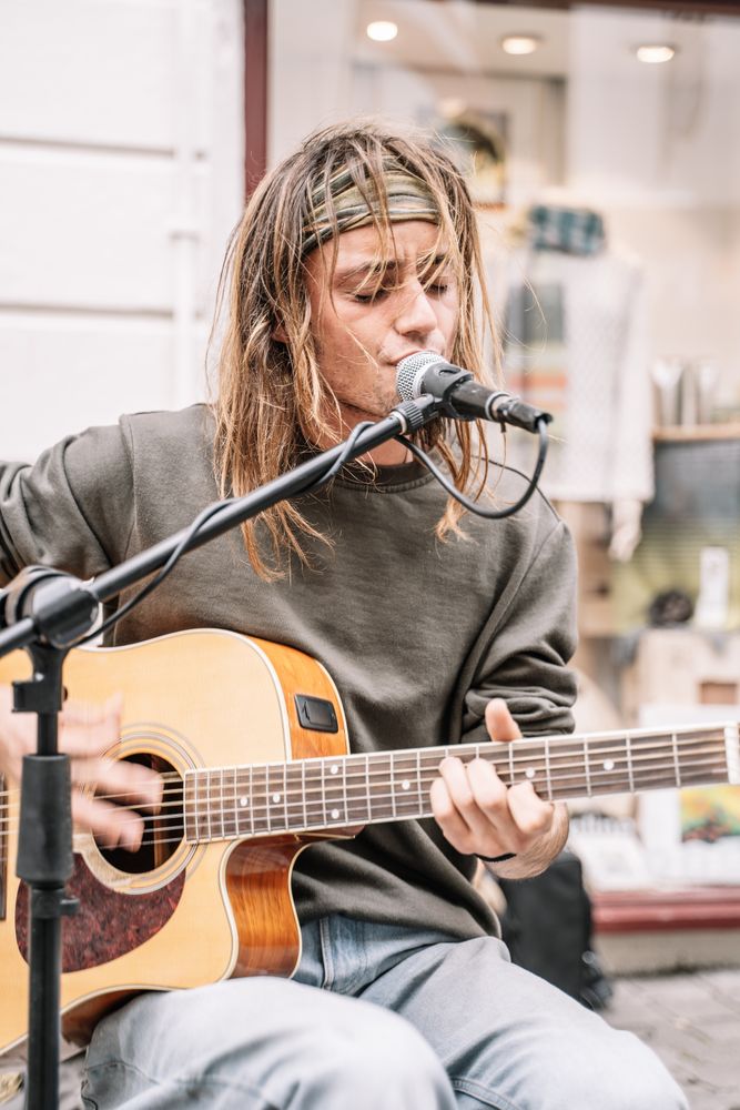 Male musician performing in the street