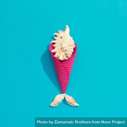 Sea shell in pink waffle cone on bright blue background 5w3ZW5