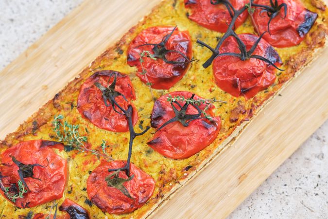 Tasty pizza with tomatoes and fresh thyme