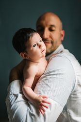 Father hugging cute baby