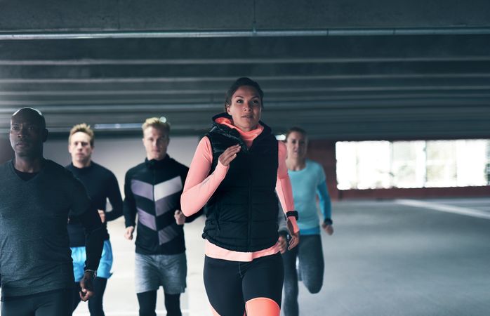 Group of people in athletic gear running