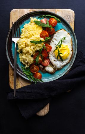 Top view of healthy breakfast plate with copy space, vertical