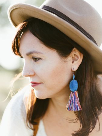Charming smiling woman with trendy accessories outdoors