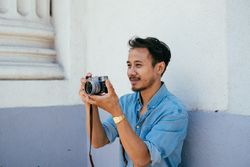 Man taking photo holding the camera in his hands