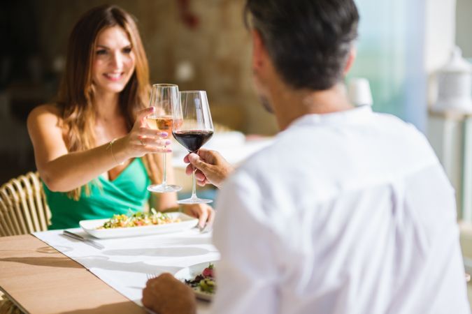 Couple clinking wineglasses during date