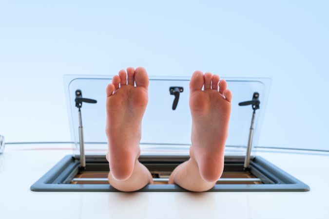 Bare feet dangling from caravan window