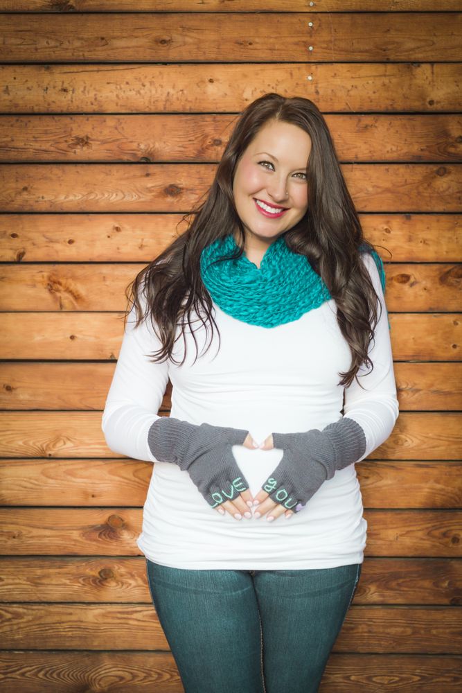 Young Pregnant Woman with Love You Mittens