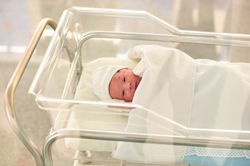Newborn baby in a hospital recovery room