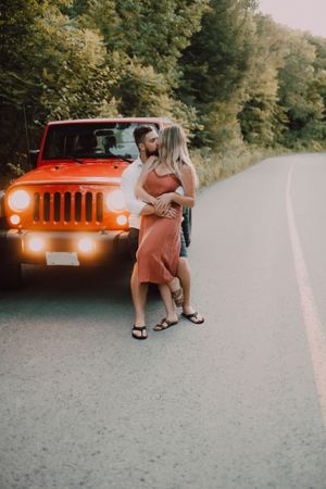 Loving couple dancing on road