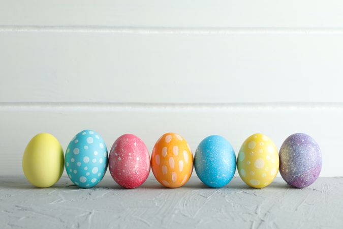 Decorated Easter eggs on color background, closeup. Space for text
