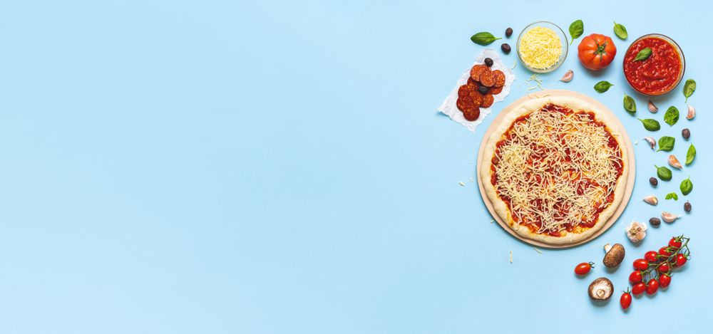 Pizza making process with ingredients displayed