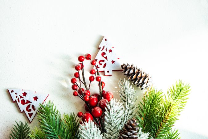 Wintry branches on bottom of image with tree decorations