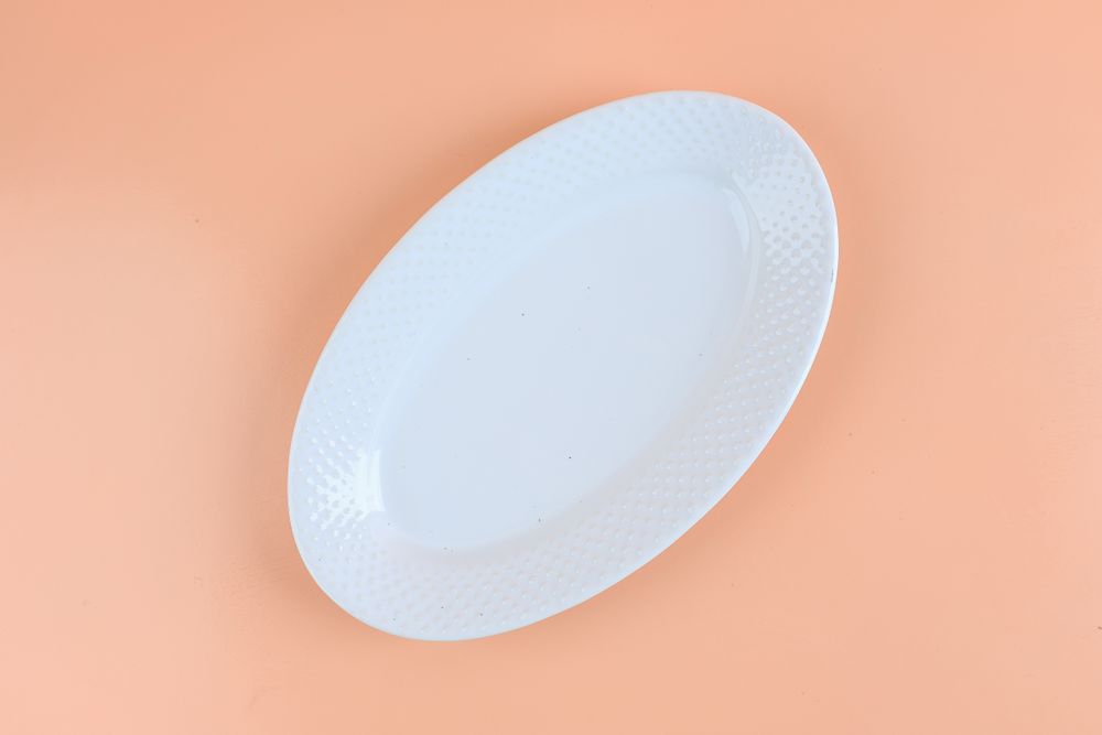 Oval Plate on Peach Table Background