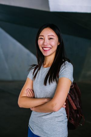 Cheerful Asian woman looking at camera