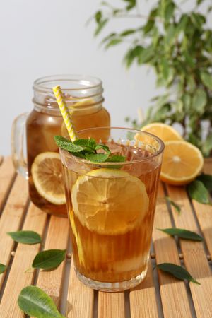 Cold tea with fresh oranges and mint leaves