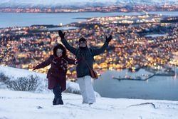 Cheerful couple having fun in snowy weather