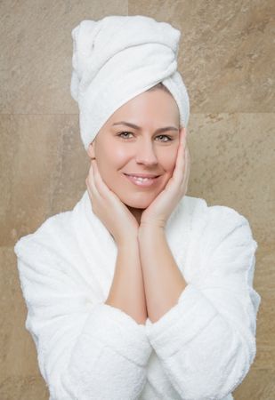 Portrait of woman with a white bathrobe