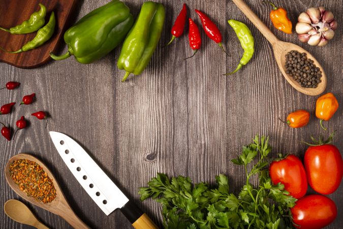 Ingredients for cooking with tomatoes, various peppers, garlic and green peppers.