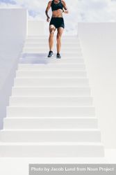 Cropped shot of athletic woman running down stairs 4Onao5