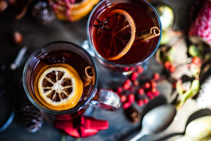 Dried orange slices and cinnamon sticks in warm drinks