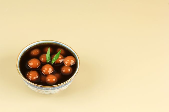 Bowl of  kolak candil with space for text