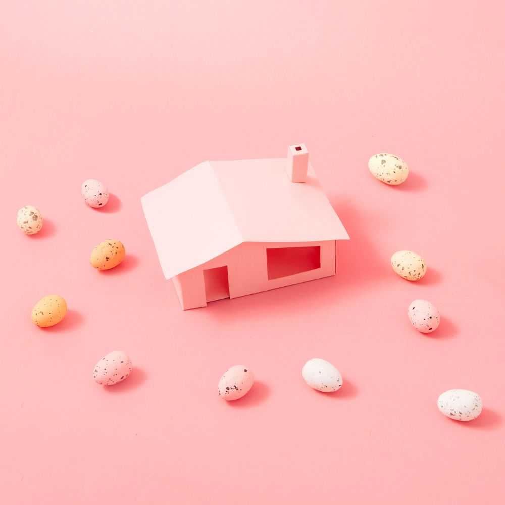 Easter eggs around pink house