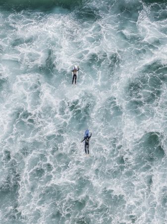 Two surfers in the ocean water