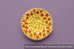 Vegetable quiche top view isolated on a purple background 0K2YAb
