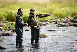 Fishermen in River Pointing Ahead