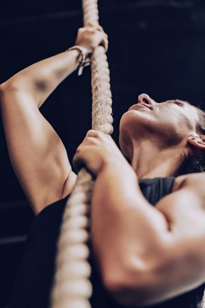 Fit female exercising in health club