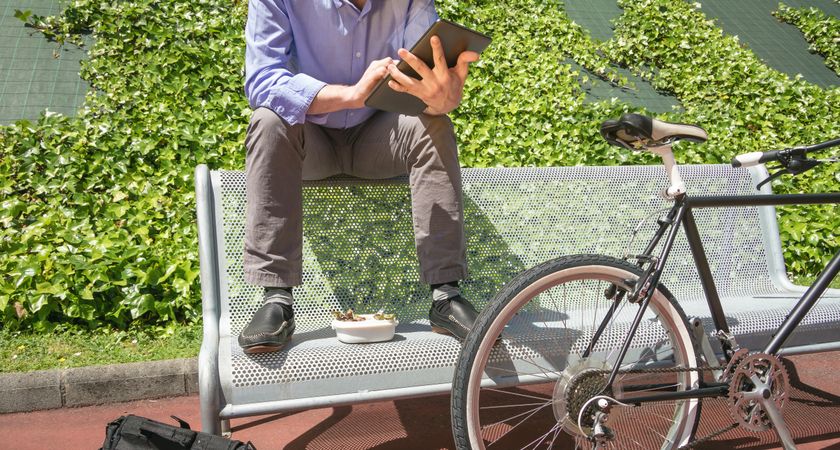 Young business man working with electronic tablet in lunch break