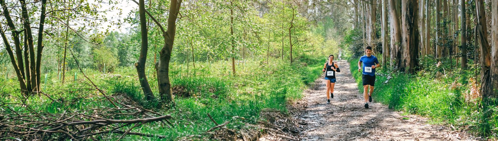 Young woman and man doing trail