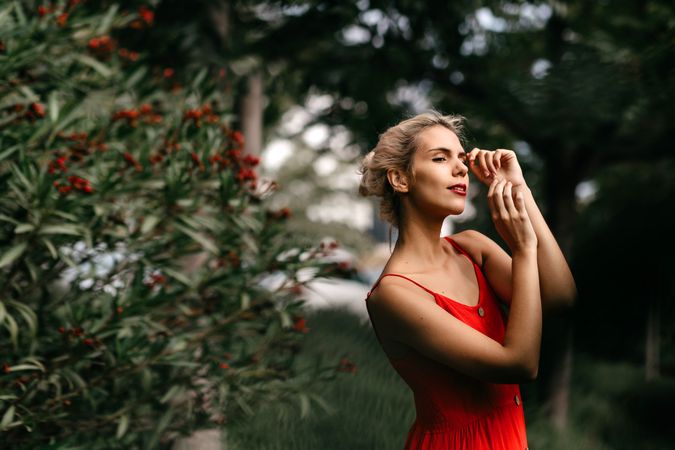 Dreamy young woman in summer garden