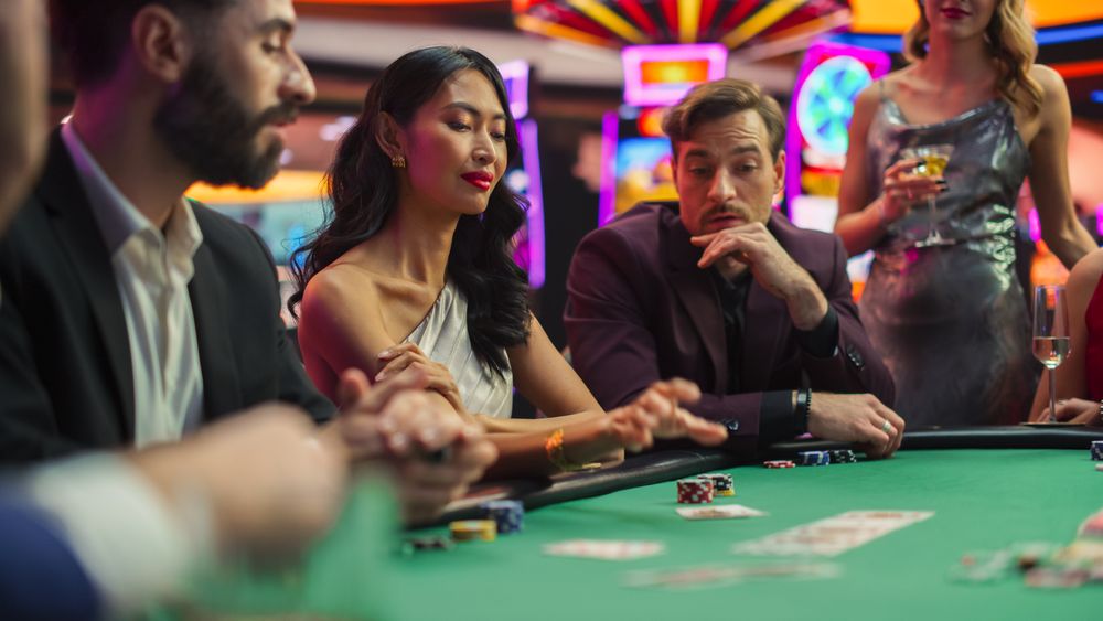 Diverse Group of People Playing Poker Championship in a Luxurious Casino.